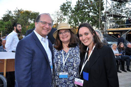 Second Generation Beverly (center) and Michael (left) Rosenbaum with Yad Vashem's U.S. Donor Affairs Liaison Jackie Frankel (right) at the Yom Hashoah 2014 State opening ceremony.